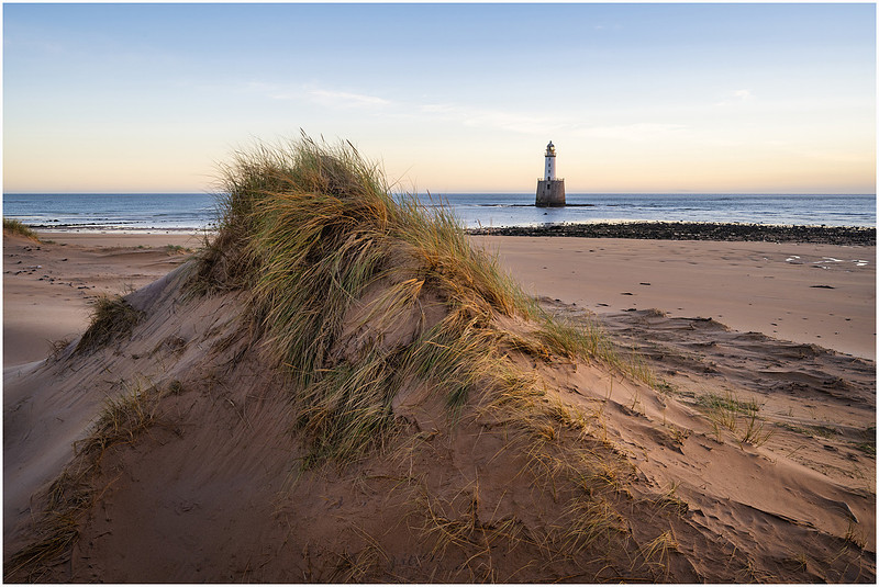 Golden sands at Rattray Head Lighthouse, Scotland.