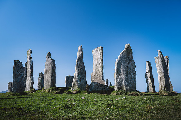 Callanish standing stones casting shadows on a sunny day on the Isle of Lewis, Scotland.