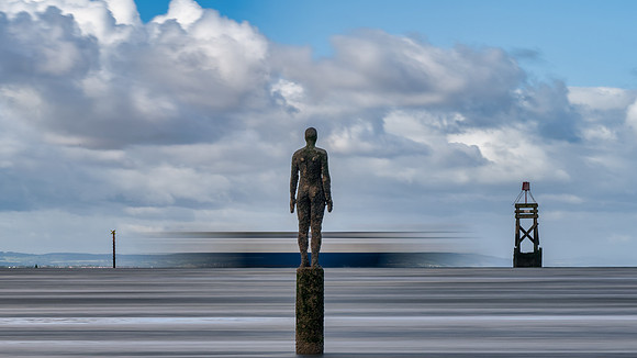 Iron men statues at Anthony Gormleys Another Place