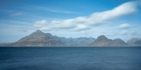 Clouds overhead of the Cuillin mountains across the bay at Elgol