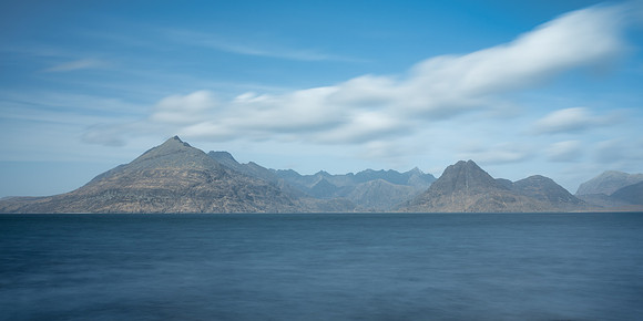 Clouds overhead of the Cuillin mountains across the bay at Elgol