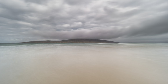 Smooth sand on Luskentyre beach overlooking Taransay Island on Isle of Harris at Lewis and Harris