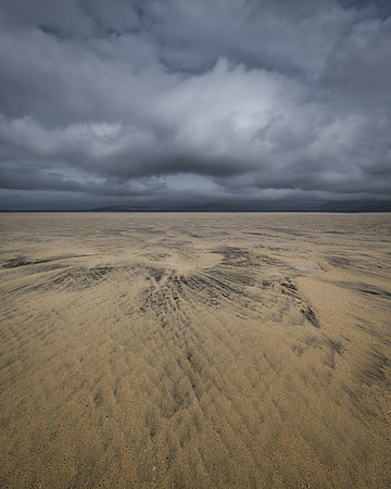 Cloud formations match lines in the sand on Sgarasta Mhòr, Isle of Harris, Scotland.