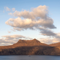 Sunset at Beinn Ghobhlach on Little Loch Broom in Scotland with a Boat on the loch.