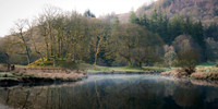 The morning mist quickly dissipated as the first rays of the sun broke through on the River Brathay, Cumbria.