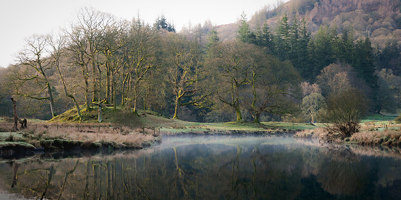 The morning mist quickly dissipated as the first rays of the sun broke through on the River Brathay, Cumbria.