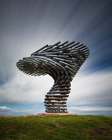 Clouds stream across the sky above the Singing Ringing Tree sculpture.
