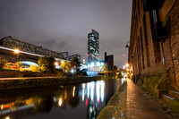 City lights and Beetham Tower reflected in the Bridgewater canal at Castlefield in Manchester.