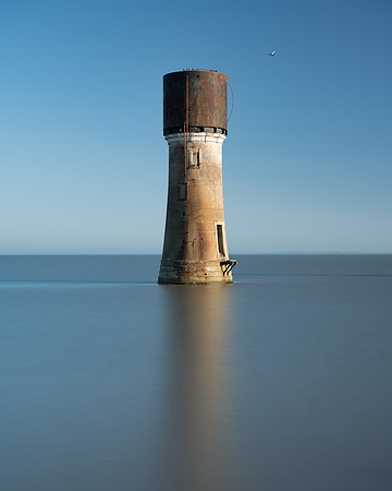 Long exposure image of water tower in the sea at Spurn point.