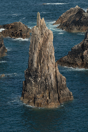 Tall sea stacks come out of the sea surrounded by high cliffs at Mangersta on Isle of Lewis.