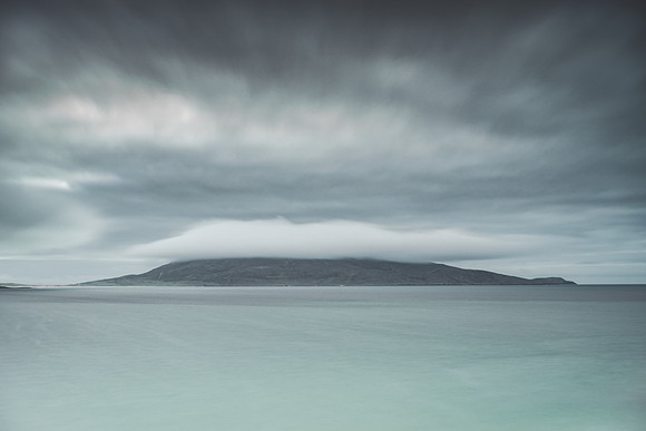 Morning cloud and a storm brewing over Ceapabhal across the sea on Isle of Lewis.