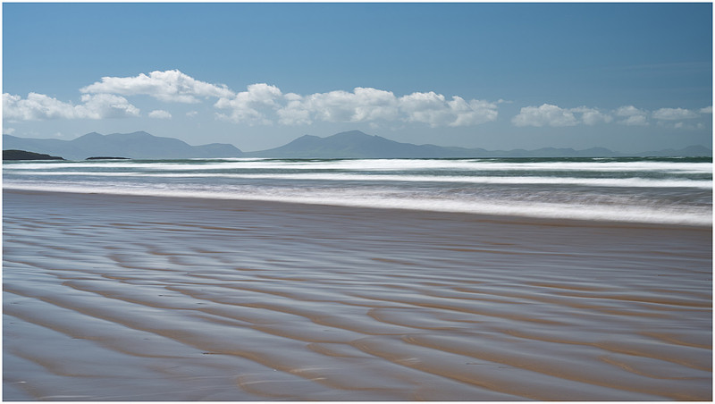 Incoming tide ripples at Traeth Mawr, Anglesey, Wales.