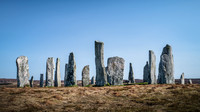Callanish standing stones casting shadows on a sunny day on the Isle of Lewis, Scotland.