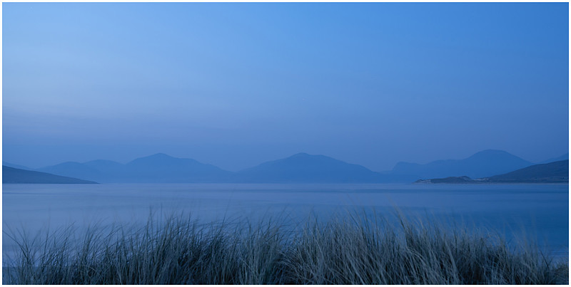 Blue hour at Horgabost beach looking to the mountains of Lewis, Isle of Harris, Scotland.