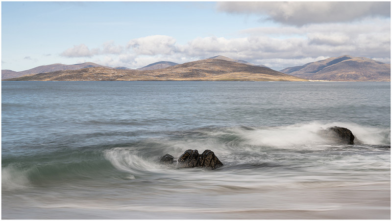 Waves over rocks at Bagh Steinigidh, Isle of Harris, Scotland.