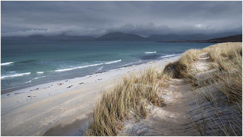 Mountains, clouds, waves, Sunshine and showers over Luskentyre beach, Isle of Harris, Scotland.